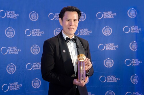 3.-K.-James-with-awards.jpeg
