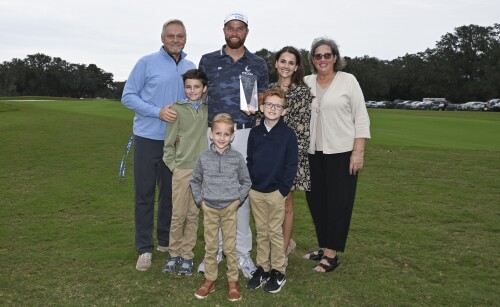 ST. SIMONS ISLAND, GEORGIA - NOVEMBER 14:  Chris Kirk poses with his family as he receives the Courage Award prior to the RSM Classic at Sea Island Golf Club on November 14, 2023 in St. Simons Island, Georgia. (Photo by Tracy Wilcox/PGA TOUR via Getty Images)