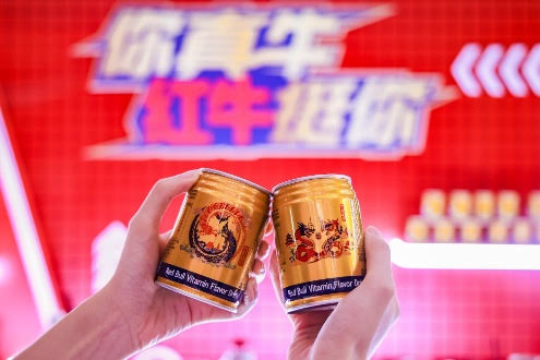 Two hands holding cans with a red background

AI-generated content may be incorrect.